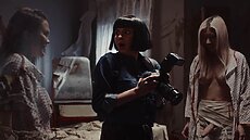 The ghosts, dressed in pale faces, dark markings, and dirty medical gowns, grab Leah, making her suck their dicks. Sarah’s expression changes from horrified to aroused, and they ejaculate all over her face.