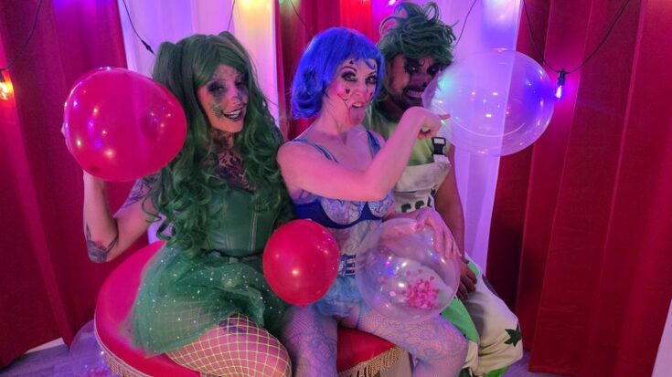 Roll up roll up its time to enjoy the show!  And joining the green cock crazed clowns on stage from the audience is Lily Kink!  Watch as they have a balloon crazy time and this cock loving slut becomes a clown and takes on this filthy pair and things get popping mad!